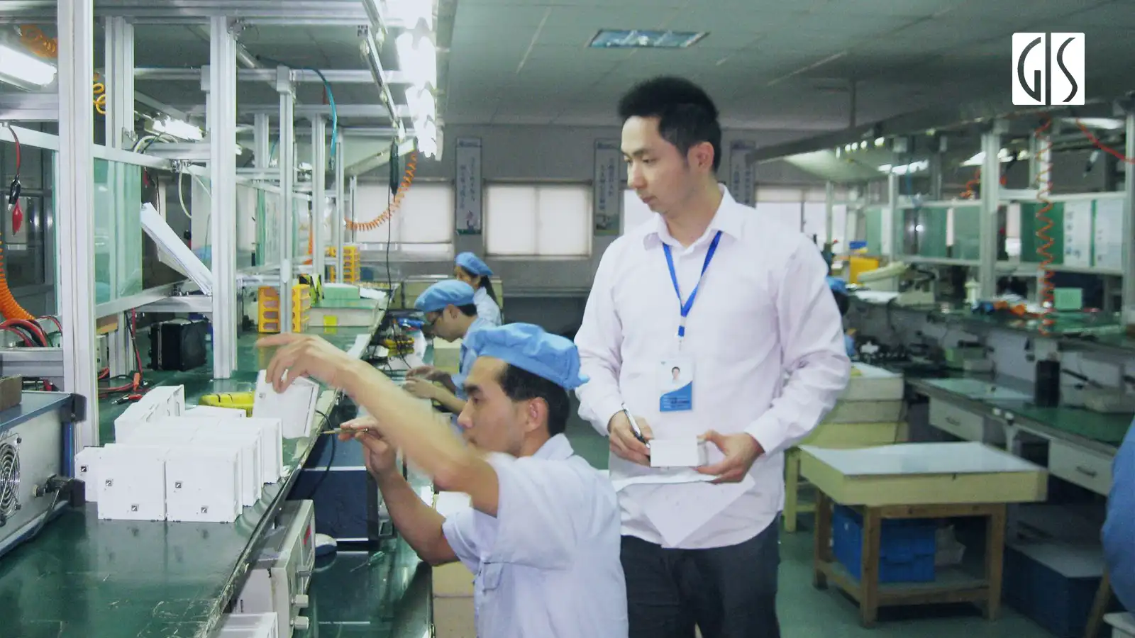 gis inspecctor is conducting pre-production inspection in an electrnic factory in China